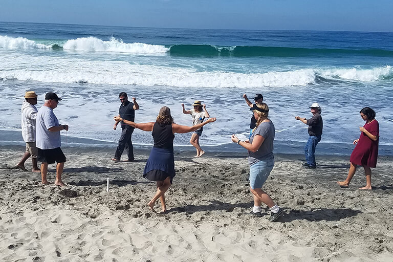 Group team building exercise at the beach