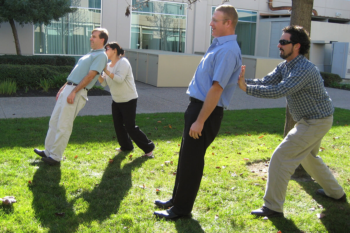 A group of people participating in a trust exercise